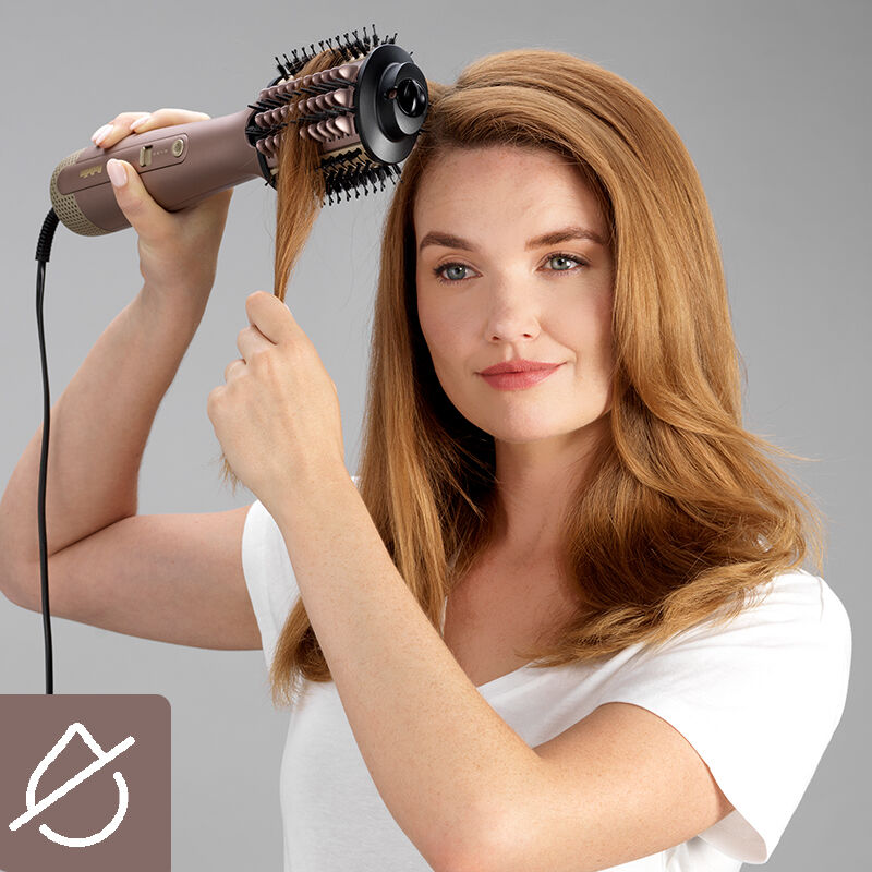 Woman styling her hair
